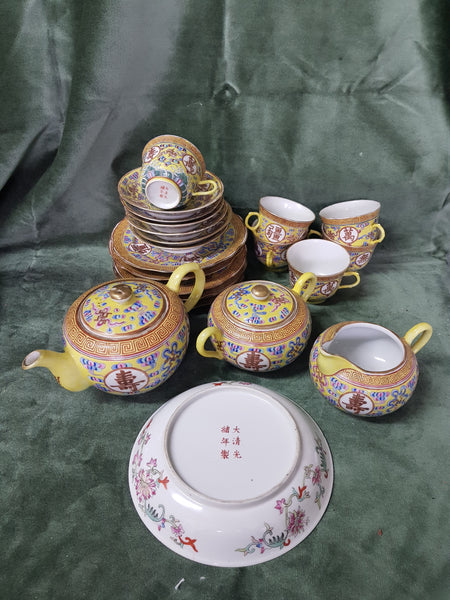 c1875-1908 Canton yellow ground tea-set Guangxu mark and period C19th comprising teapot/jug/bowl, 6 cups/saucers/plates and sweet meat dish, 22 pieces, bowl 19cm dm, teapot 12cm tall, plates 18cm dm, creamer 8cm tall #216
